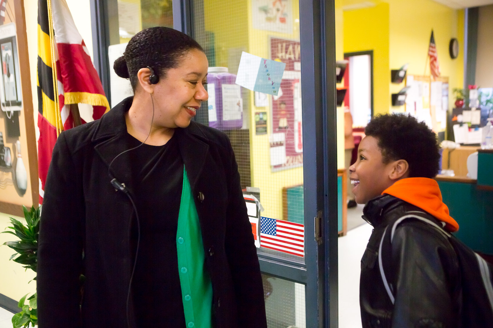 Student and teacher outside a classroom at a New Leaders school