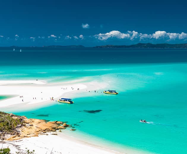 Tours boats anchored at Whitehaven Beach