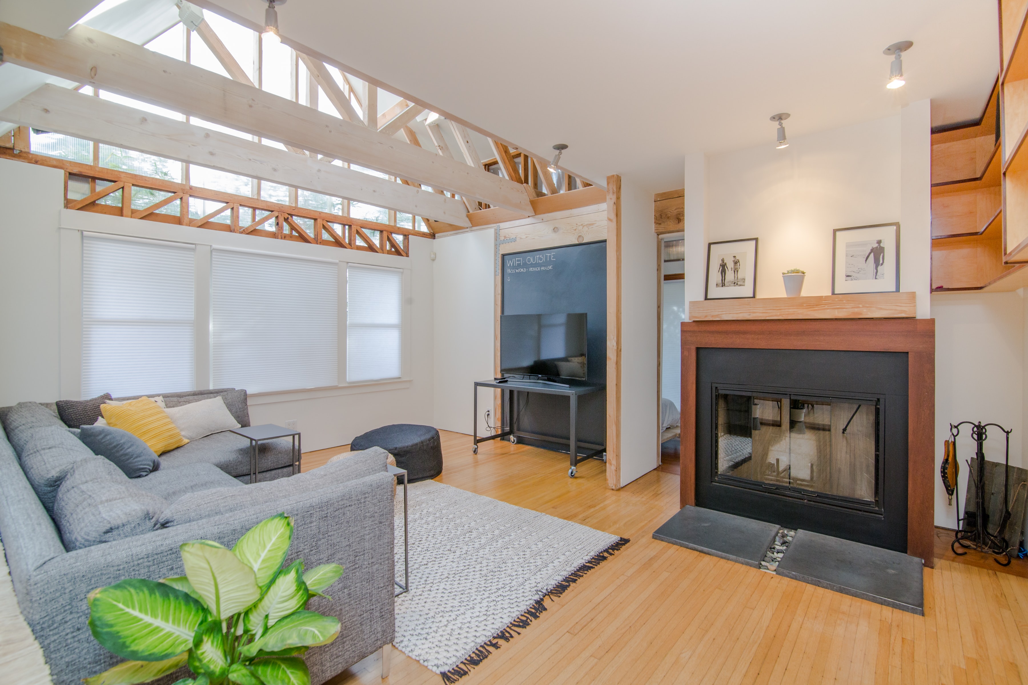 Bright interior of a home with fireplace and vaulted ceilings