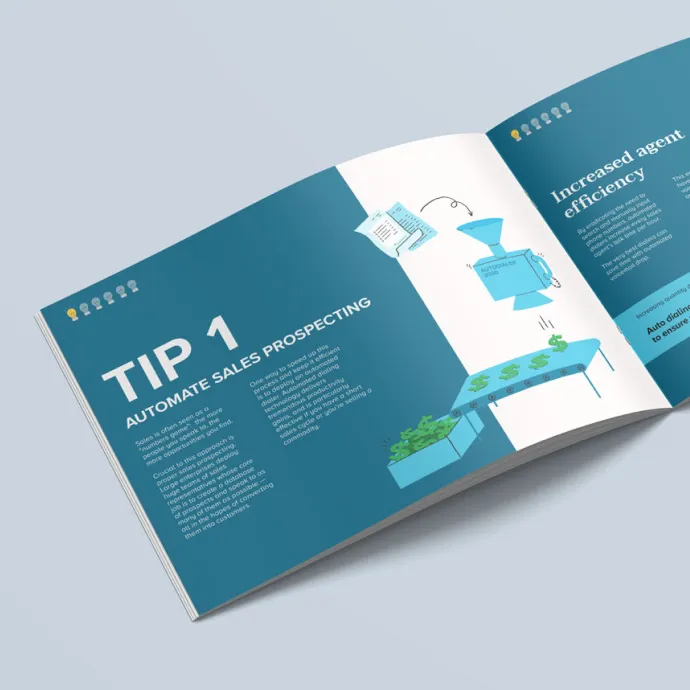 Image of an open booklet sitting on a light blue surface.