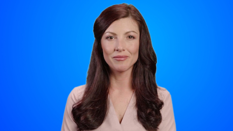 Charlotte, an AI video spokesperson against a blue background