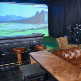 Image of the golf simulator room, a perk for employees of Christensen Group Insurance