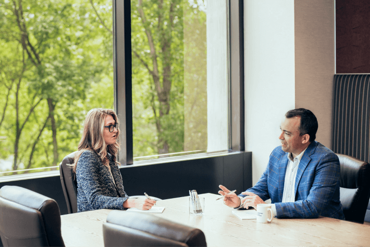 Christensen Group Insurance agent meeting with a client in our main conference room