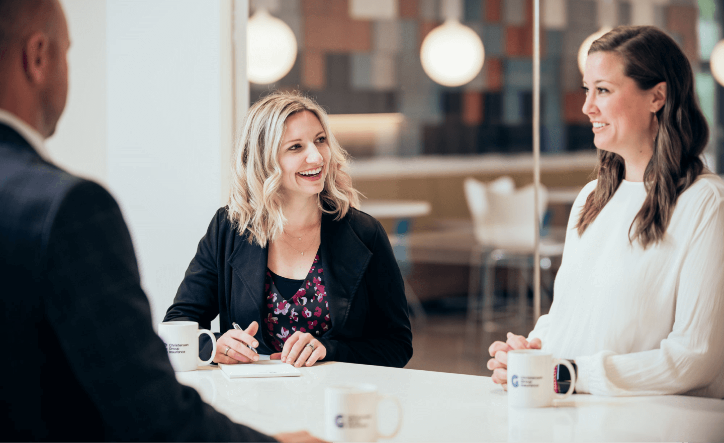 Christensen Group Insurance agent listening to a client