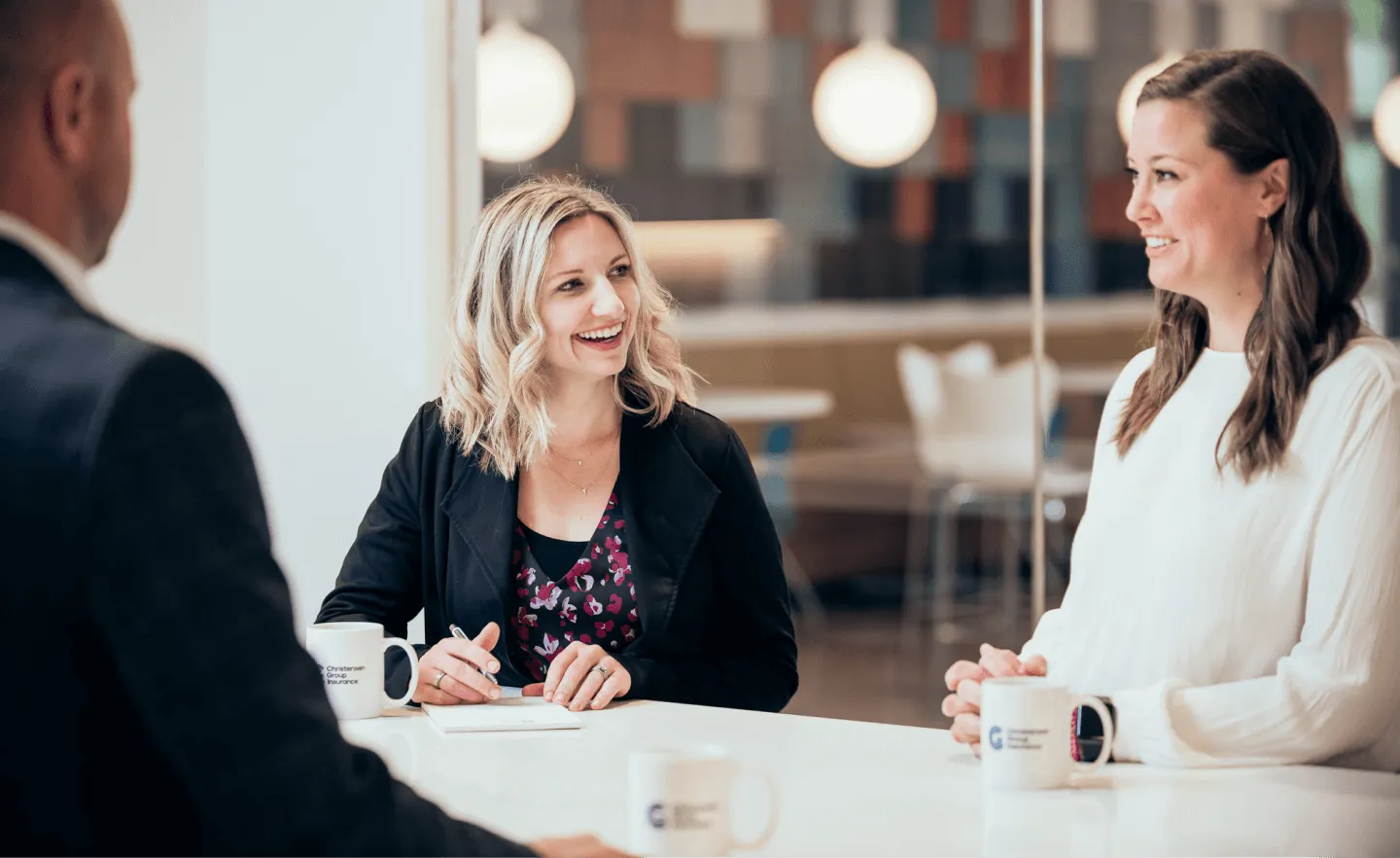 Christensen Group Insurance agent listening to a client