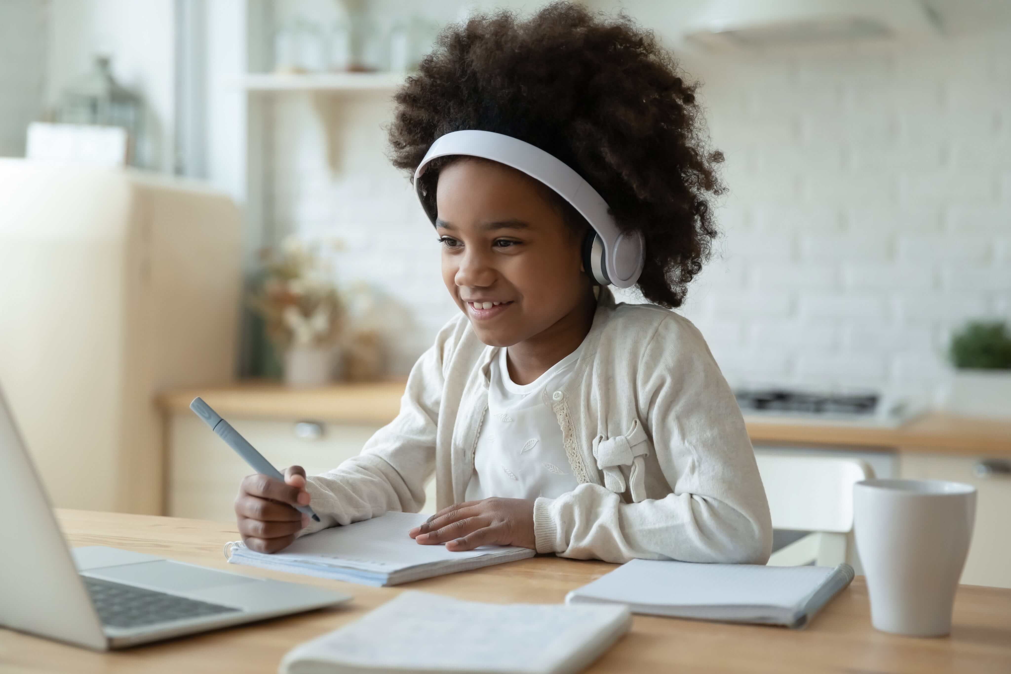 school child looking at laptop