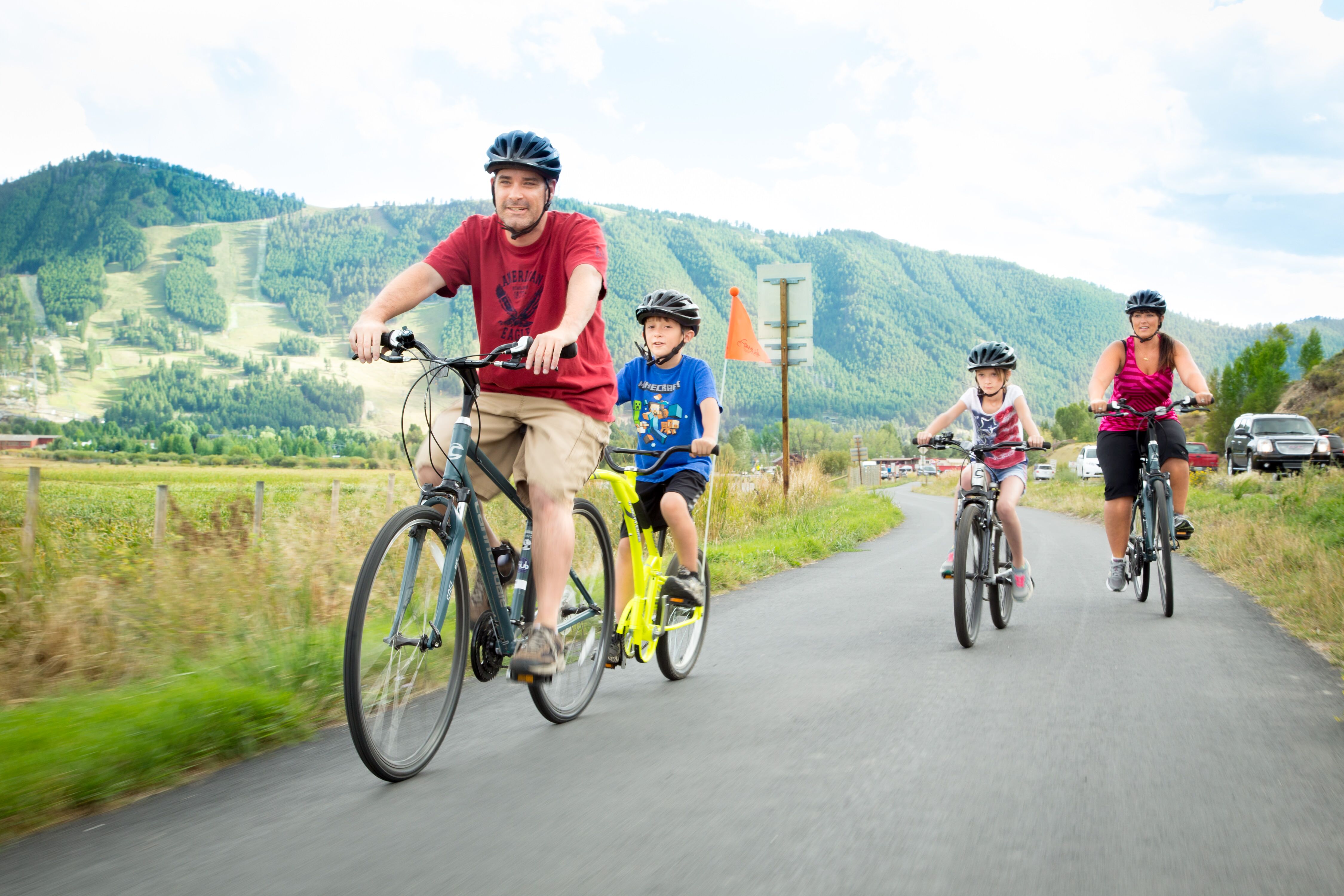 family biking on path