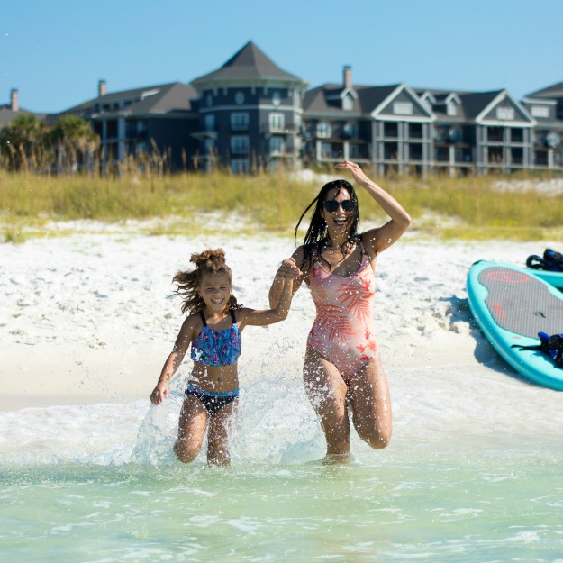 A woman and child enjoying a day at the beach