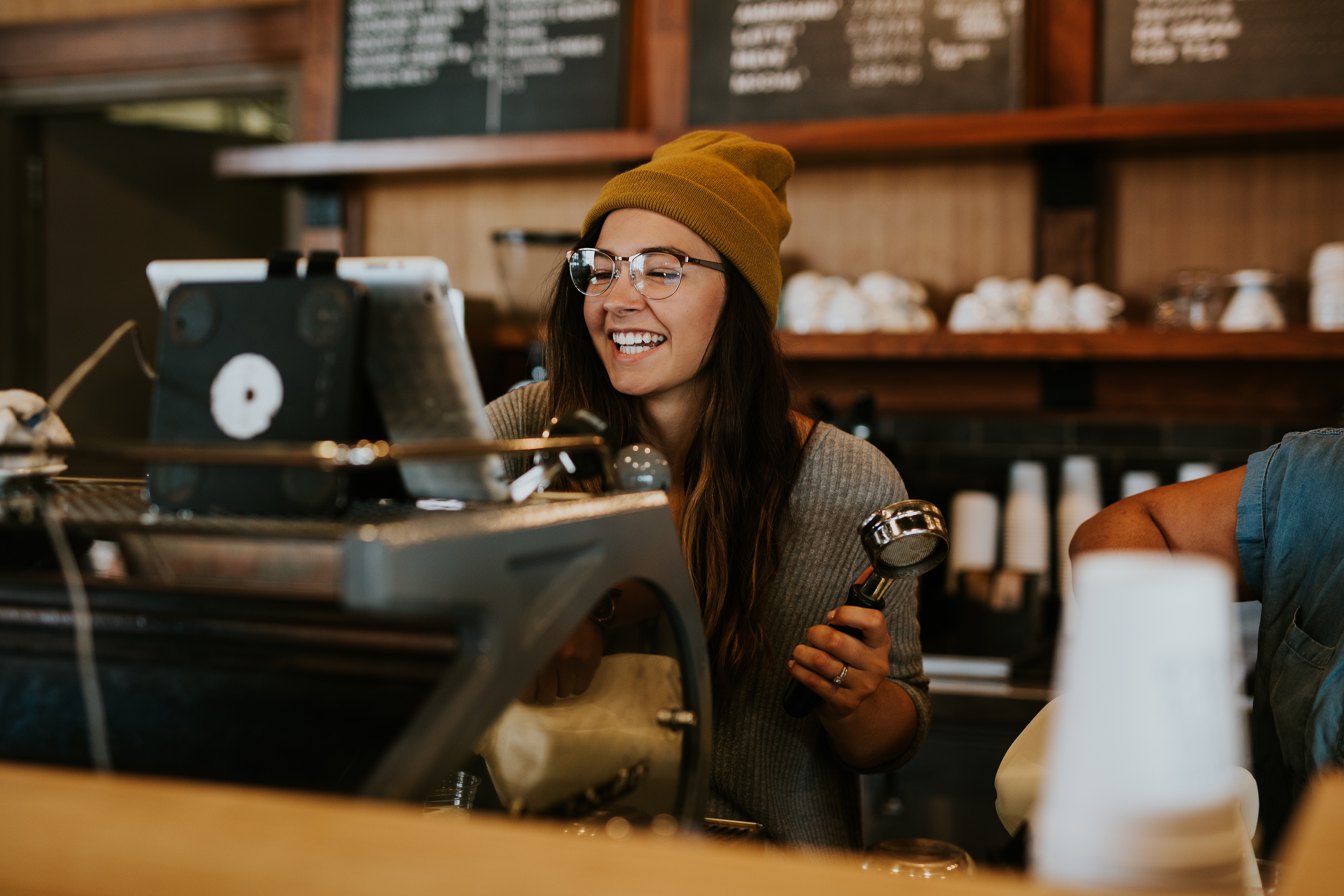 Happy barista at checkout