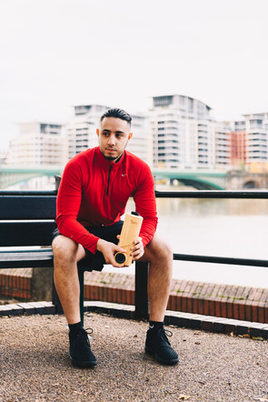 Miti Life Bamboo Water Bottle designed by Innovolo. Man sitting on bench