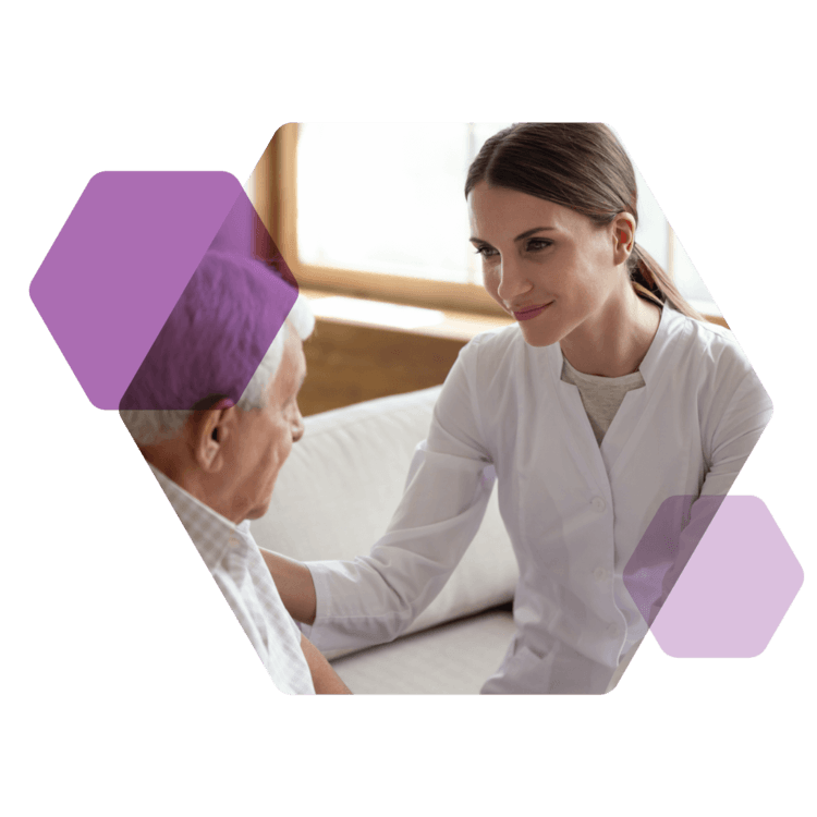 Nurse in white works with an older patient