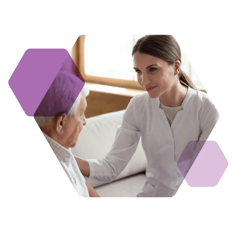 Nurse in white works with an older patient