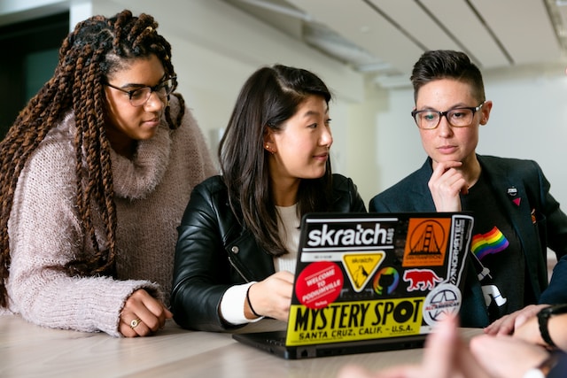 Teens working on laptop