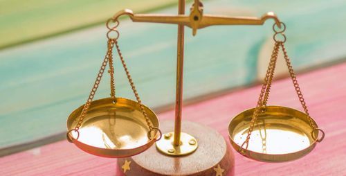 balance scale on colorful wood