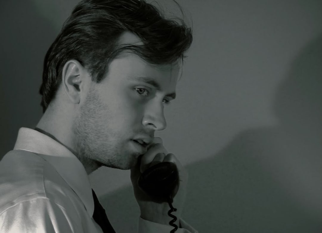 Man using an old rotary phone