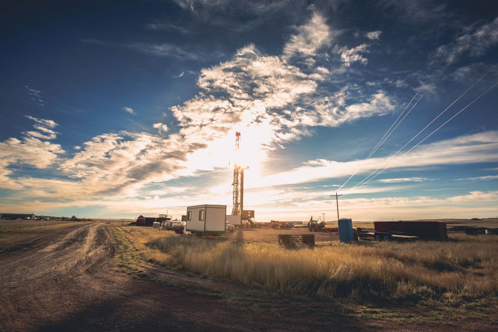 Sun shining on mining equipment in field