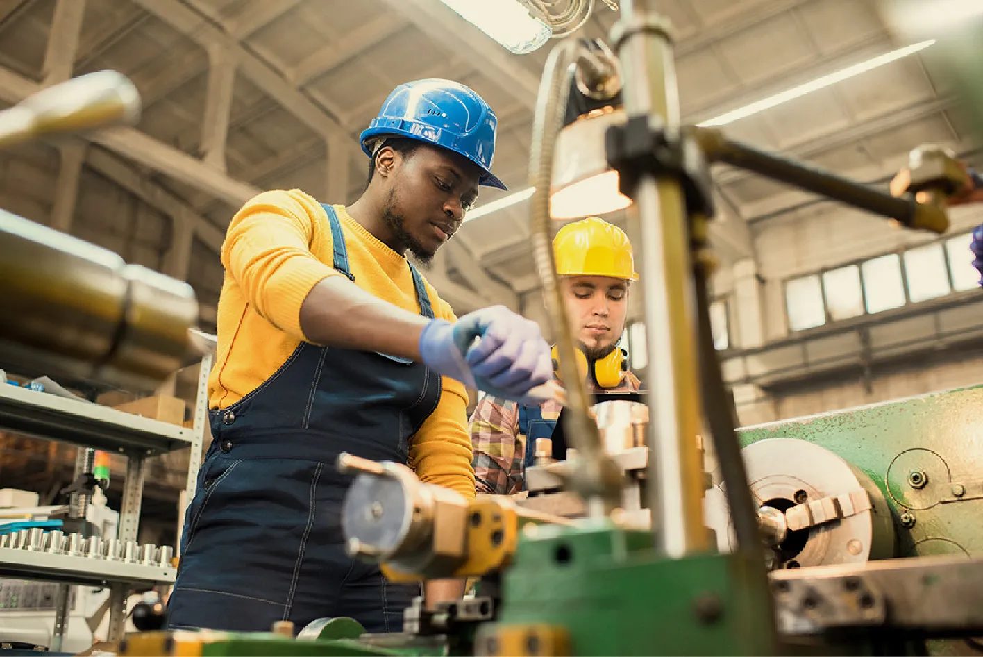 two workers in assembly line