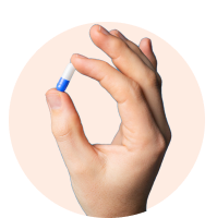 hand holding a pill