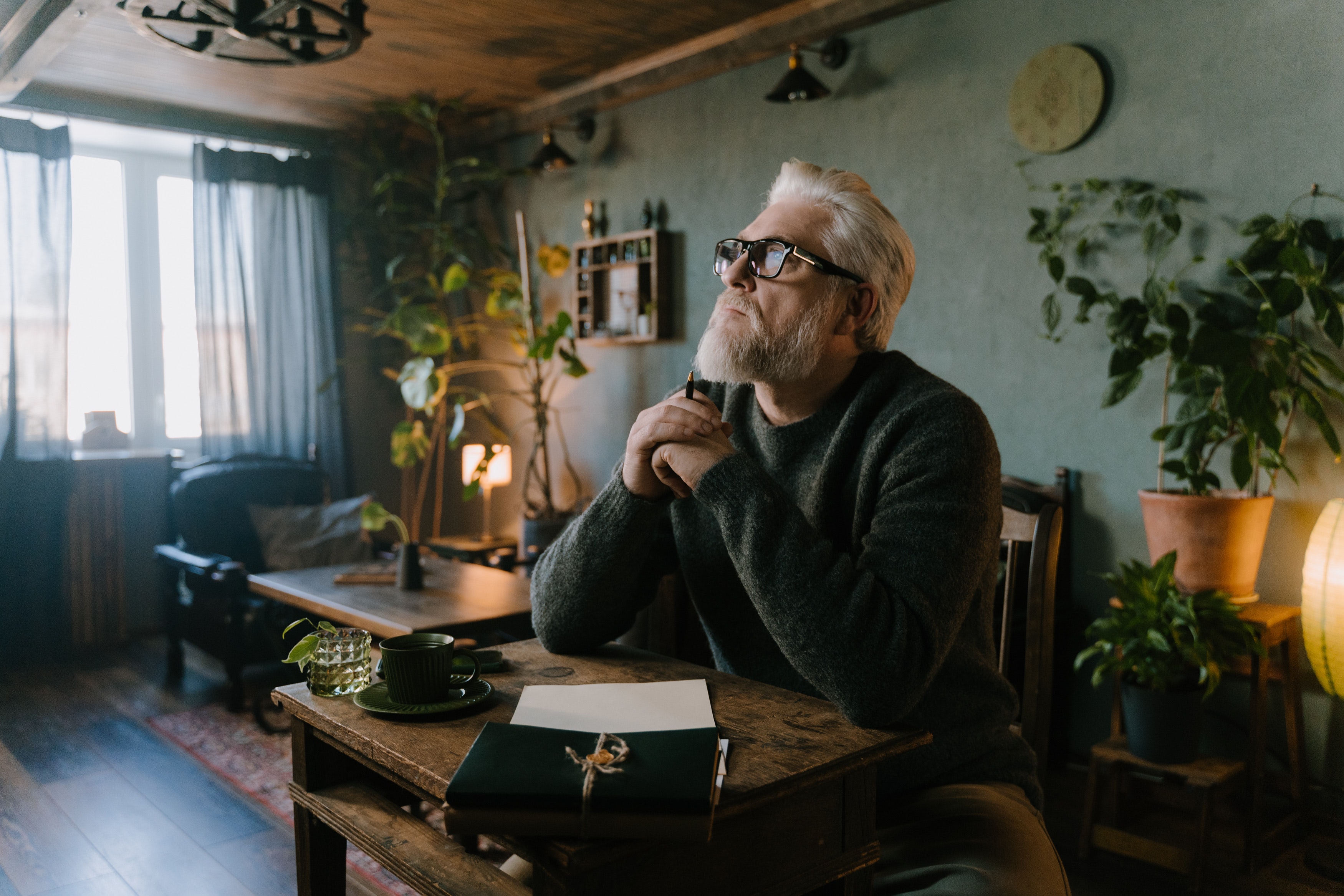 Elderly man writing his life story