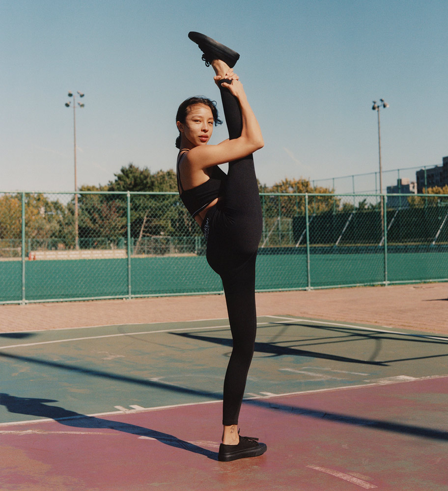 Calvin Klein woman exercising with leg stretched