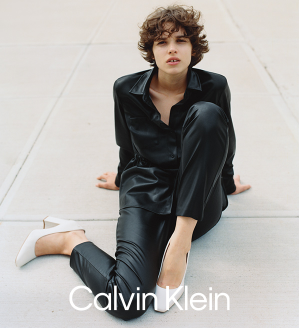 Calvin Klein woman exercising with leg stretched
