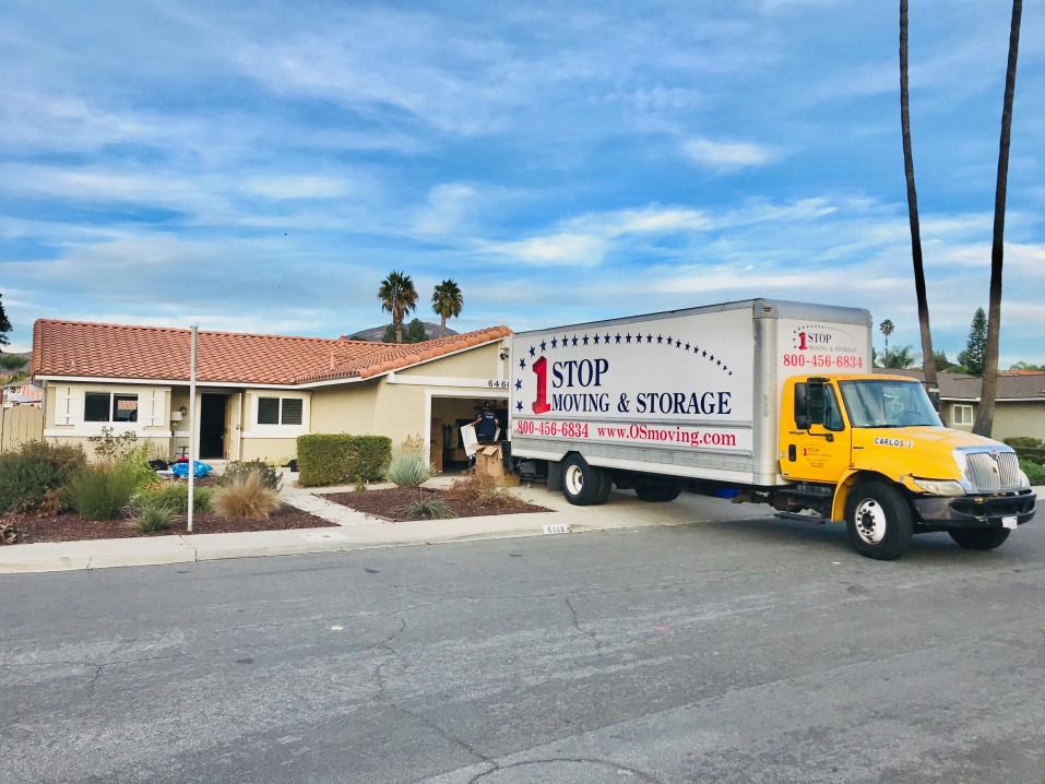 Moving Truck Parked Into Of A House That Is Covered With Dp1 Insurance Policy