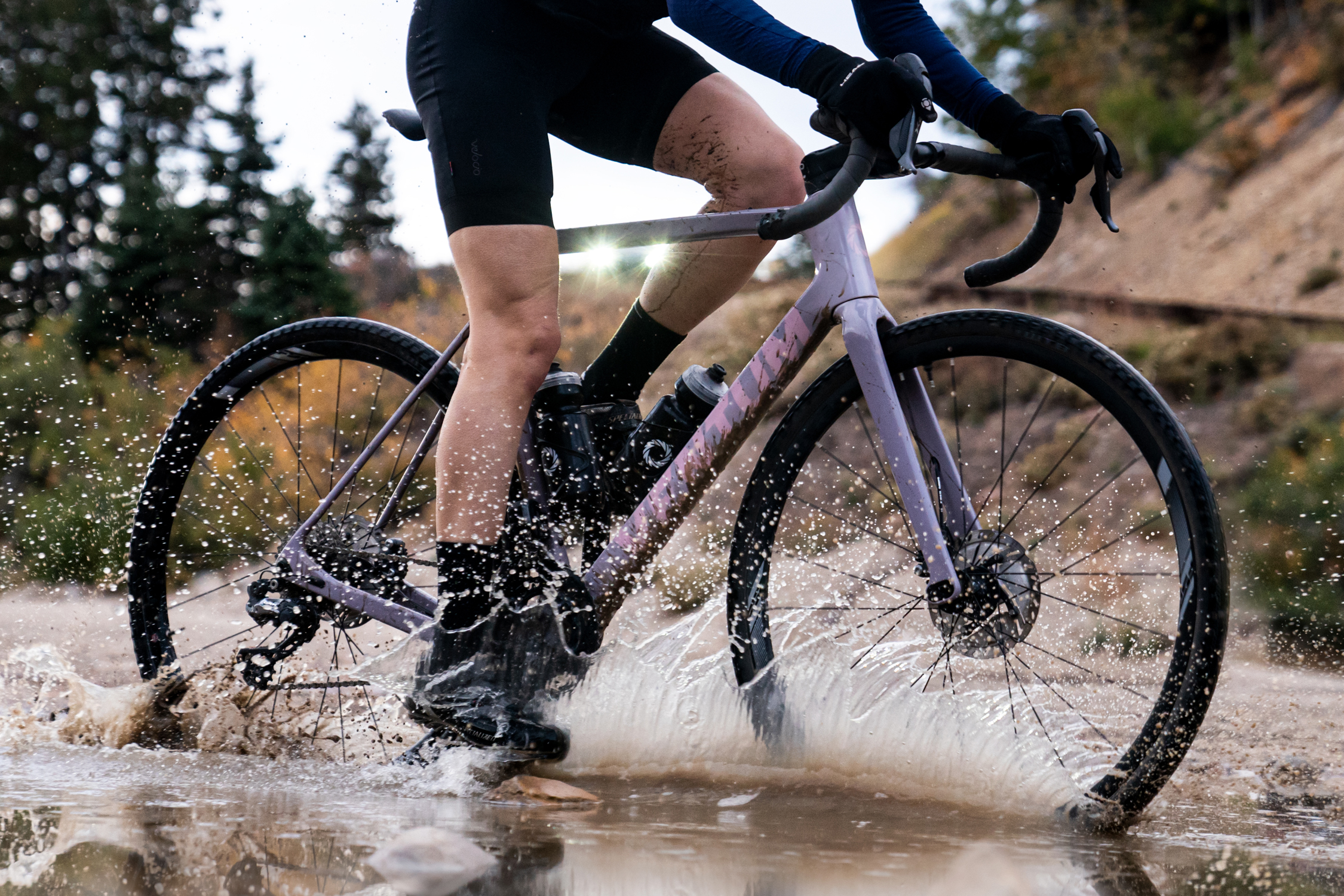 A rider going through a mud puddle