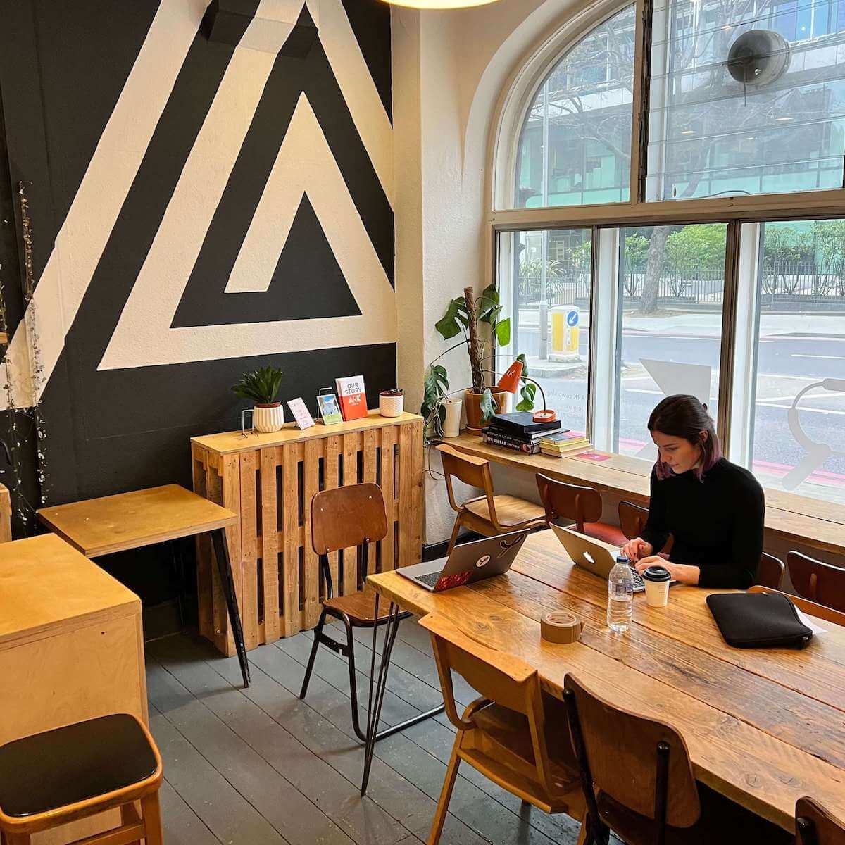 A Yonder employee working at their downstairs cafe