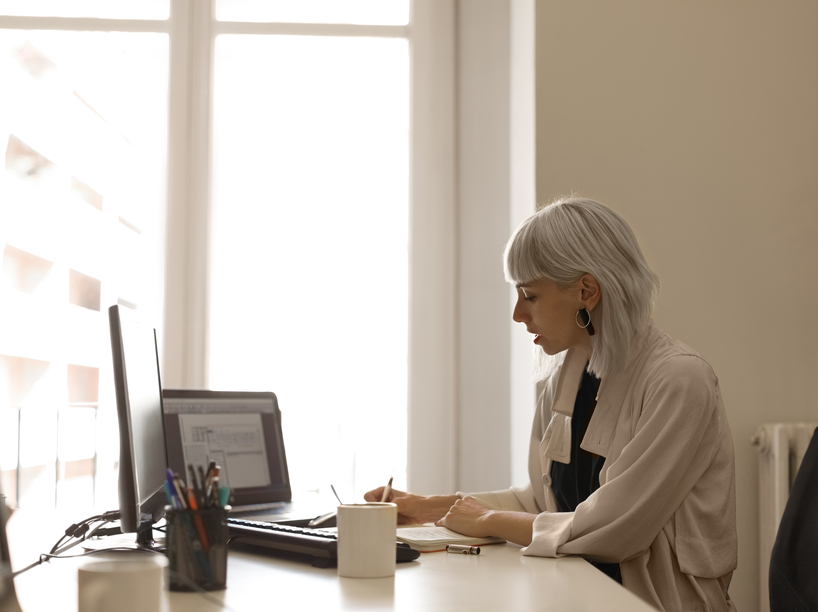 bill being checked for accuracy by woman at desk