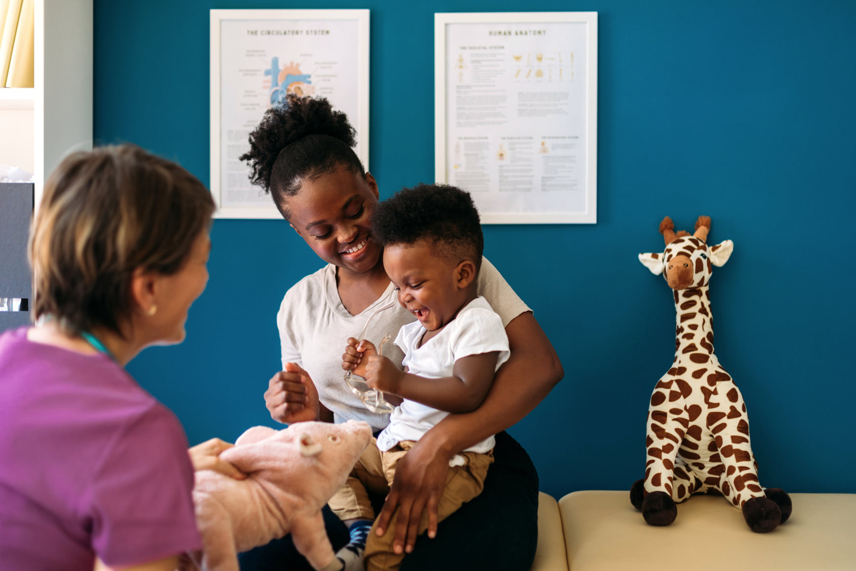 a woman with her child at the pediatricion