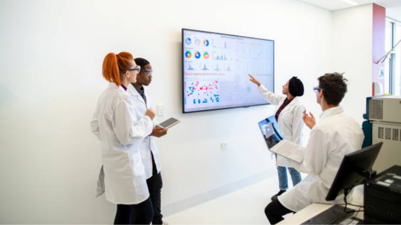 medical students reading on television screen