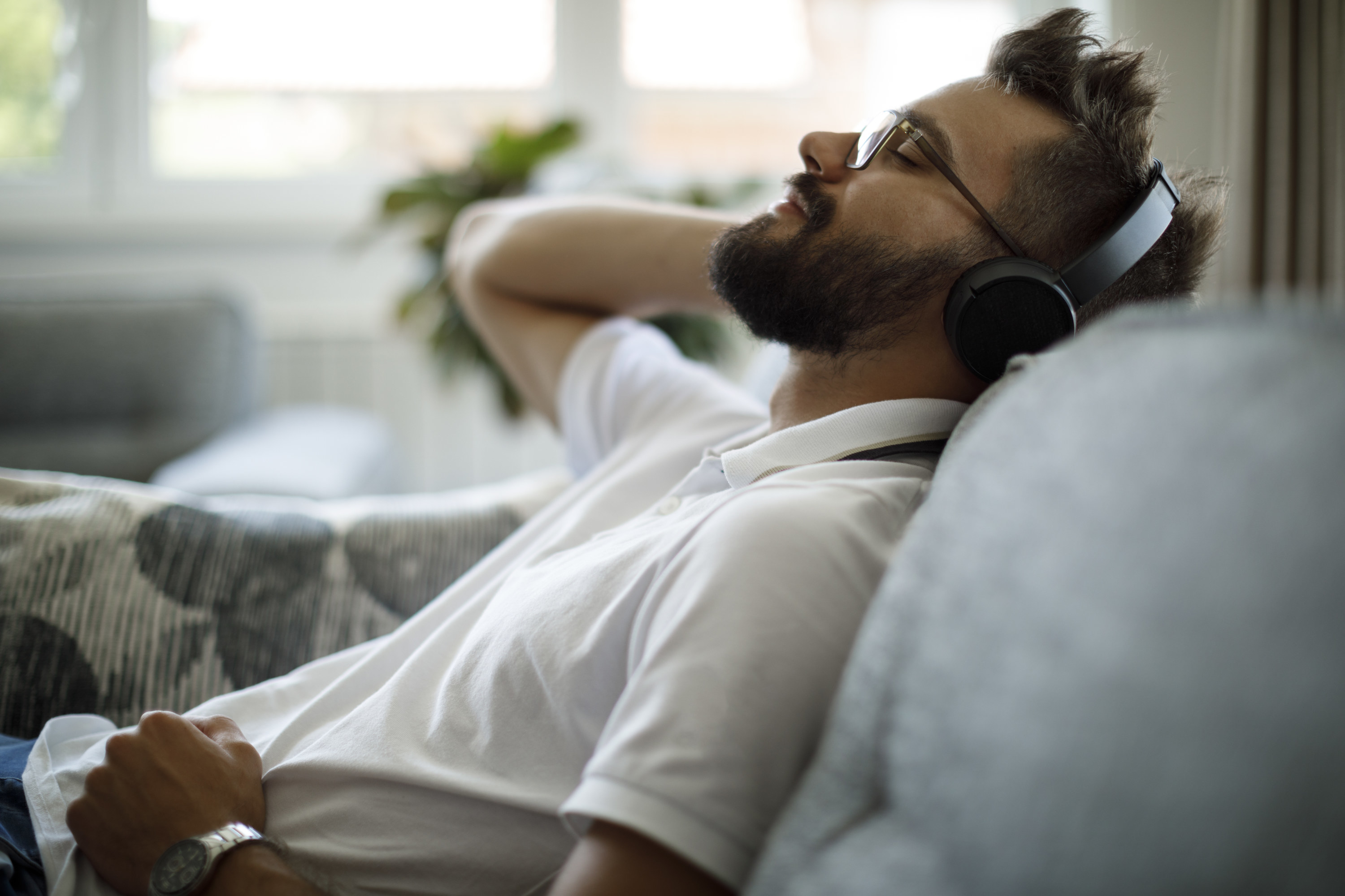 guy sleeping and listening to music