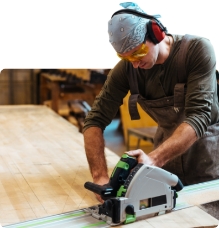 Carpenter using a electric saw to cut wood