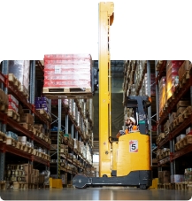 High reach forklift truck in a warehouse lifting boxes