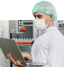 Worker diagnosing issues with a food manufacturing machine
