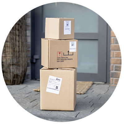 An image of 3 packages in front of a door showing how the Swiftly retail tool can expand inventory through fulfillment.