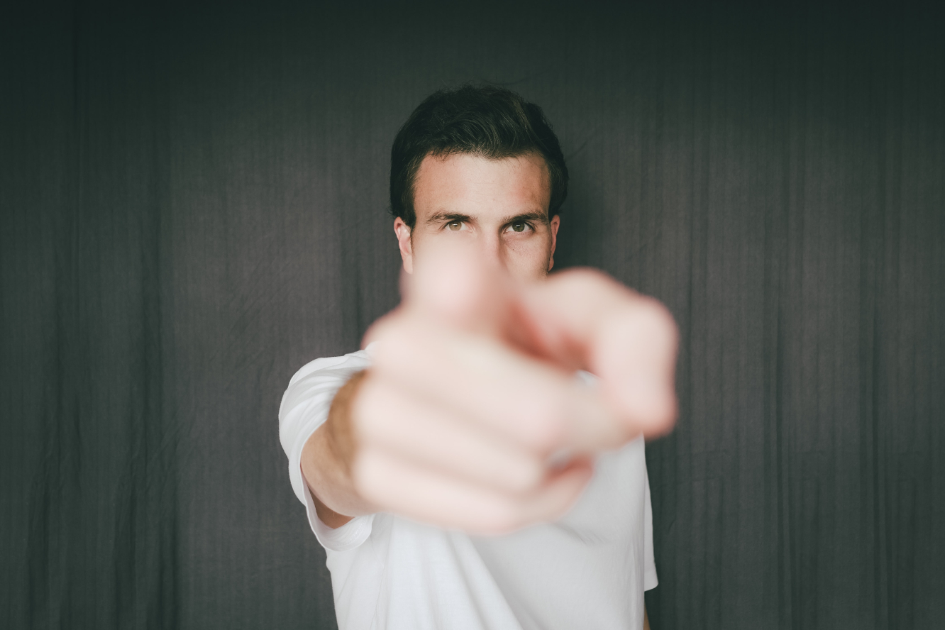 a man pointing directly at you.