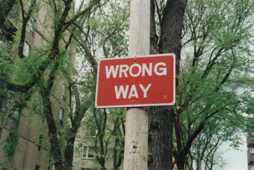 A wrong way street sign.