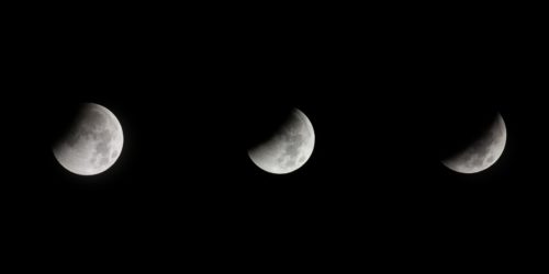 Three moons in a row, each in a different phase, against a black background