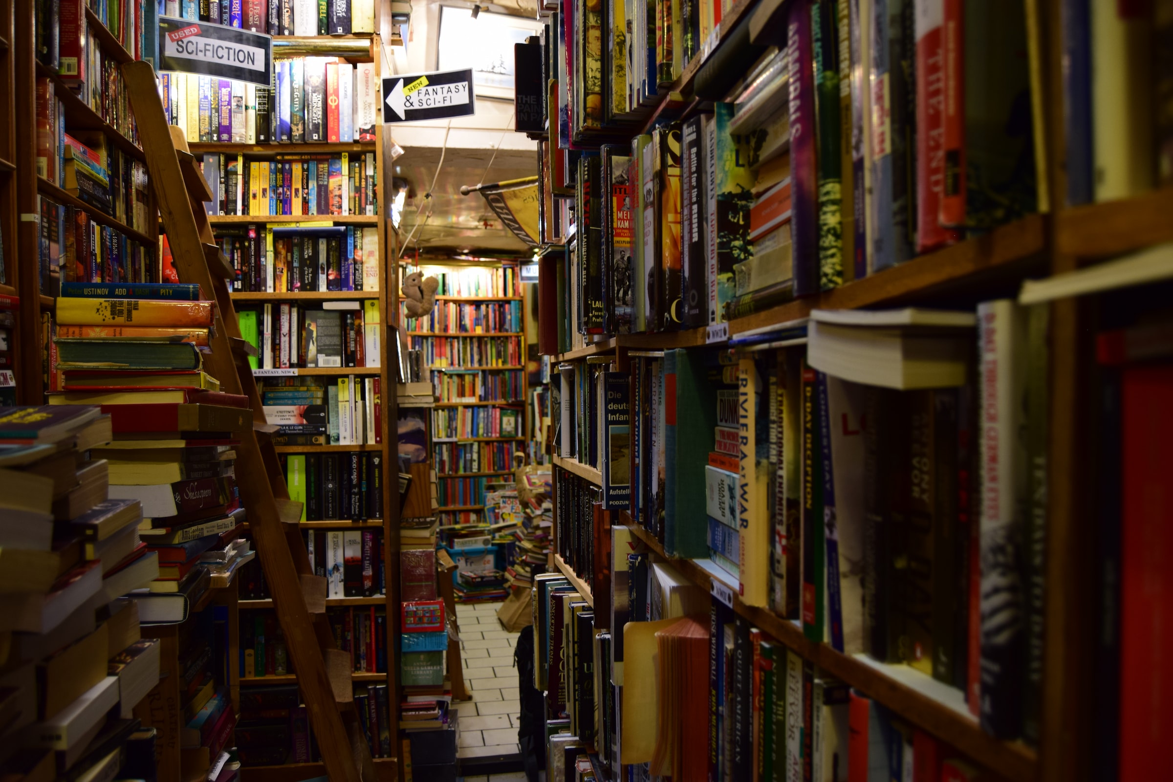 Bookshelves full of sci-fi books in a bookshop.