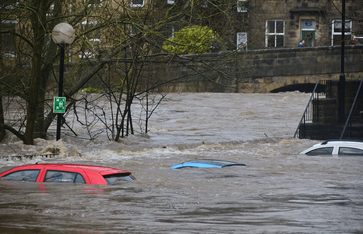 Cars submerged in water from flood.