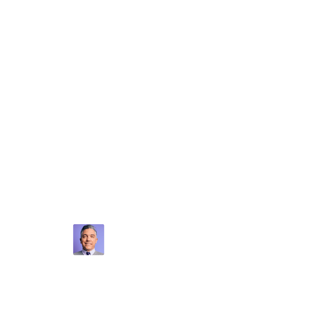 Gabriel Perez, a man with short gray hair and a tie smiling