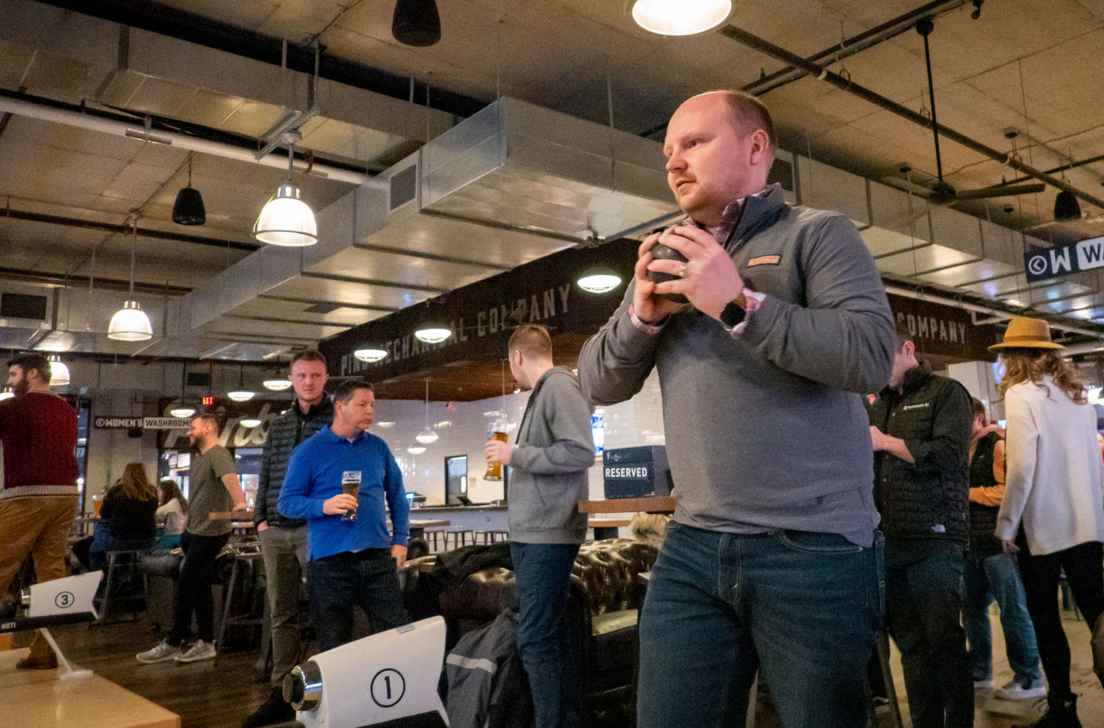 Seamless.AI company outing playing mini bowling