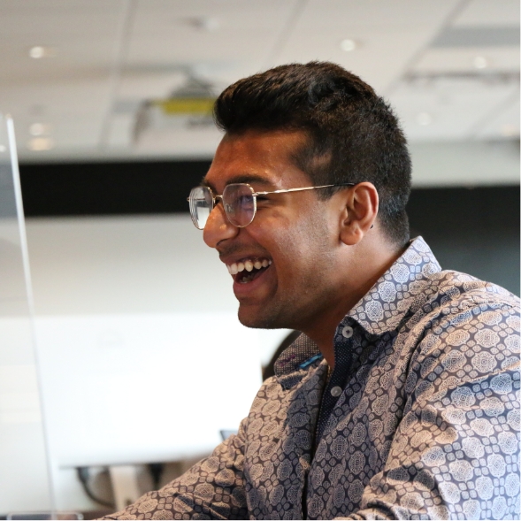 male Seamless employee smiling