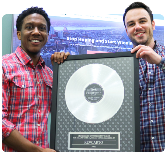 2 men holding their 7-Figure President's Club award