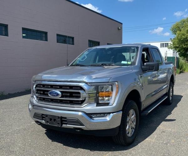 A silver Ford F-150 in a empty parking lot