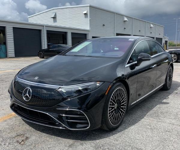 A black 2022 Mercedes-Benz EQS in a dealership parking lot