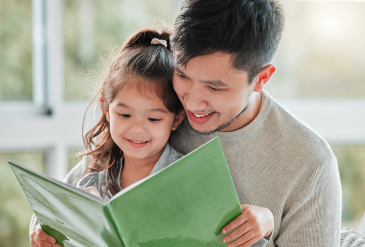 adult and child reading together