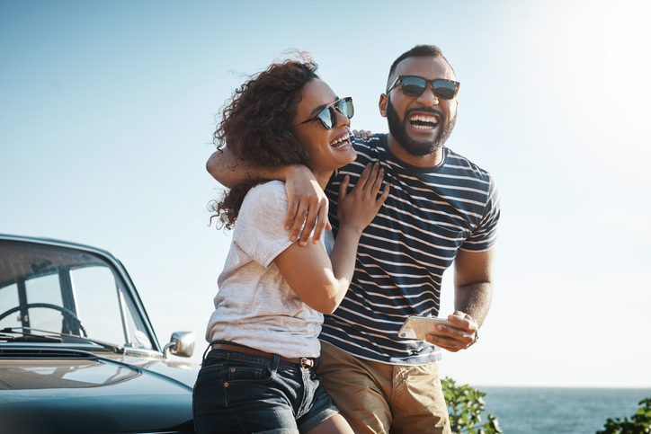 young couple enjoying a summer’s road trip together