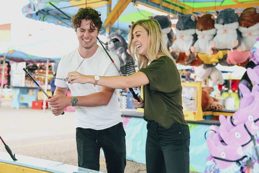 two people playing a midway game at k-days